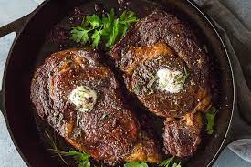 I cook steaks in a pan by putting them in the pan and putting it on the stove at medium heat. How To Cook A Perfect Cast Iron Skillet Steak Featured