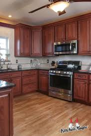 Check spelling or type a new query. These Classic Cherry Cabinets With Black Glaze Coordinate Perfectly With The Dark Gra Cherry Cabinets Kitchen Beautiful Kitchen Cabinets Kitchen Cabinet Styles
