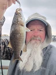 Kentucky Dam...** **"I snagged this Asian carp in the tail. Heck of a  fight, thought it was a big stripper."**