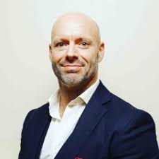 Paul 'Baz' Barrett, a Colour Sgt in the Royal Marines, stood