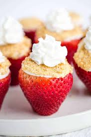 Strawberries & cream fresh strawberries and whipped cream layered between delicious strawberry cake with a cream cheese frosting. Cheesecake Stuffed Strawberries Cookie Dough And Oven Mitt