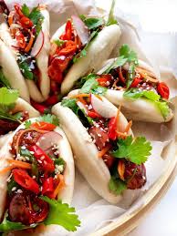 Steam Heat Bao Down There S A New Bun In Town Steamed Instead Of Baked Chinese Bao Buns Are Pillowy Puffs Of Simple Yea Bao Buns Duck Recipes Pork Belly Bao