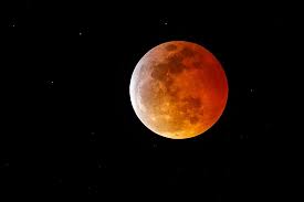 A blood moon is when light filtered through earth's atmosphere during an eclipse turns the moon a rusty, reddish hue. Ijqb02juuzithm