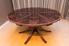 Save an extra £100 on current price! Walnut Curl Expanding Circular Dining Table Johnson Furniture