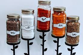 There's room for 16 round, small spice jars in the stand, which are included in the set. How To Make A Cheap Diy Spice Rack With Recycled Jars