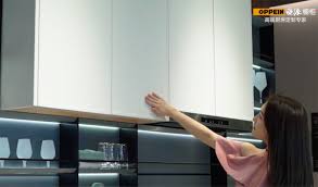 Add some pops of color with cookware and decor. Morandi Pink Modern Kitchen Design