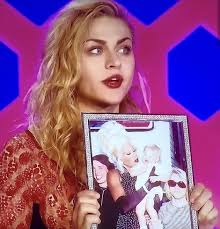You've definitely seen this photo of a very young Frances Bean Cobain  wailing in the arms of a 1990s-era Rupaul Charles, but do you know the  *story* behind it? The picture was