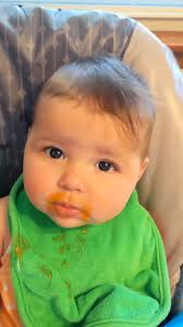 Lily Rose eating some sweet potatoes. She's crying because I'm not fee...