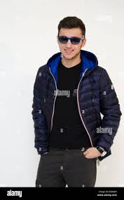 Teenager wearing sunglasses and jacket isolated on white background Stock  Photo - Alamy