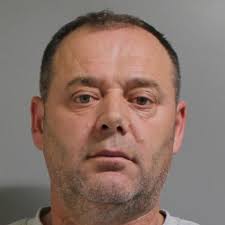 An alleged 'peeping Tom' who was found crouching with his pants unzipped  near a ground-level bedroom window at a local apartment complex was  arrested after evidence believed to be his bodily fluids