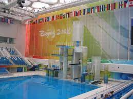 These measurements create a surface area of 13,454.72 square feet and a volume of 88,263 cubic feet. The Olympic Diving Pool Photo