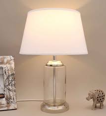 We would like to show you a description here but the site won't allow us. Buy White Cotton Fabric Shade Duffield Clear Glass Table Lamp With Transparent Base By Kapoor E Illuminations Online Traditional Table Lamps Table Lamps Lamps And Lighting Pepperfry Product