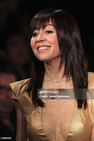 Fatima Lopes salutes the crowd after her fashion show during Paris... News  Photo