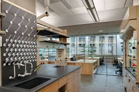 Energy Intensive Laboratory Spaces Are Grouped And Separated From Office And Write Up Areas By Glass Partitions That Laboratory Design Design Hospital Design