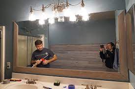 The one that remained was a basic plate glass mirror that was glued to the wall. Diy Bathroom Mirror Frame For Under 10 Hello Hayley Blog