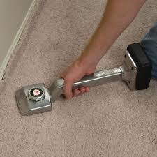After that, we're going to take our knee kick, go to the middle of the room and kick it straight back towards. Carpet Stretcher Knee Kicker Wellers Hire
