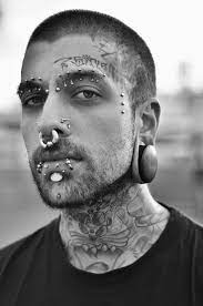 Pin By Michael Igi On Piercings Face Piercings Face Tattoos Facial Piercings