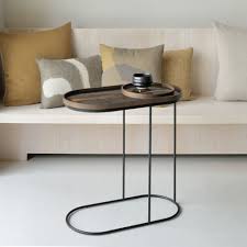 A combination of clear glass and steel gives the studio designs home camber 48 in. Oblong Tray Side Table Ethnicraft Coffee Table With Metal Frame And Black Wooden Top Sediarreda Com