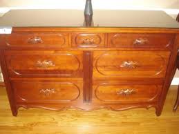 Usa, circa 1960s carved oak, with original brass hardware. Lillian Russell Davis Cabinet Co 7 Drawer Dresser 60x21x36 With Mirror And Beehive Drawer Pulls Current Pric Davis Furniture 7 Drawer Dresser Drawer Pulls