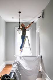 If the wall has a handrail, then you will need to use masking tape to cover it. How To Easily Paint Ceilings And Stairwells Without Ladders Or Scaffolding 11 Magnolia Lane
