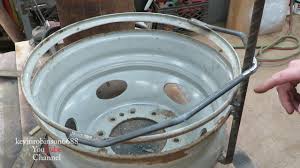 Surround it with brick and, or simply use it as a durable fire pit ring. How To Build A Fire Pit From A Truck Wheel Youtube