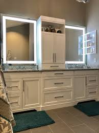 Custom White Double Vanity With Center Tower And Led Mirrors We Love All The Storage We Now Have Th Double Vanity Bathroom Spa Bathroom Decor Bathroom Design