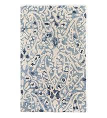 Pairing neutral hues with a subtle pop of pattern, this elegant area rug is a stylish staple for your master suite or living room. Indoor Outdoor Rug Light Blue Patterned Rug Cream Plowhearth