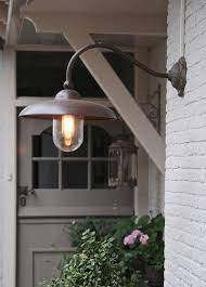 Wall mounted light fixtures pair well on each side of a door or alone to illuminate the house number. 27 Impressionable Front Door Light Fixtures Interior Design Inspirations Farmhouse Light Fixtures Exterior Light Fixtures Porch Lighting