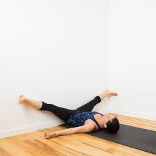 You Ll Feel So Much Better After This Restorative Wall Yoga Sequence Basic Yoga Poses Yoga Poses Basic Yoga