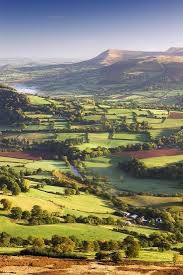 Car driving on countryside road in wales,uk.idyllic landscape,lambs,green hills with trees,blue sky. The River Usk And Rolling Countryside In The Brecon Beacons National Park Powys Wales Uk Autumn Photographic Print Adam Burton Art Com