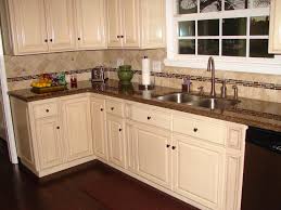Antique White Raised Panel Cabinets And Tropical Brown Granite Counter Tops Travertine Glass Back Kitchen Cabinets And Granite Antique White Kitchen Kitchen