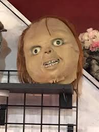 Thrift store find: large pine cone with glued feathers