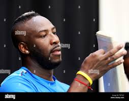 West indies andre russell checks hi-res stock photography and images
