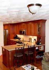 Shaker Kitchen Cabinets In Maple Cognac Glass Kitchen Cabinet Doors Granite Countertop Porcelain Backsplash Ri Kitchen Cabinets Kitchen Remodel Kitchen Redo
