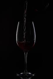 Check spelling or type a new query. Closeup Shot Of Red Wine Pouring Into Glass From Bottle Isolated On Black Background Free Stock Photo And Image