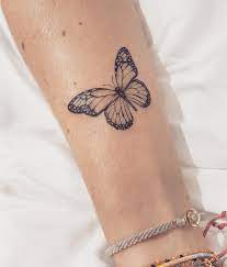 This monarch butterfly tattoo is a solid black piece and looks great on the upper thigh is a great alternative to the cliche bows that everyone seems to have these days. Butterfly Tattoo Is One Of The Most Popular Tattoo Ideas Butterfly Tattoos Are Becoming More An Butterfly Tattoos For Women Tattoos For Women Butterfly Tattoo