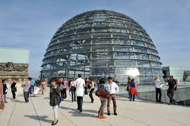 Travel and politics in berlin concept. German Bundestag Registering To Visit The Dome Of The Reichstag Building