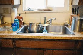 dirty dishes in kitchen sink by rob and