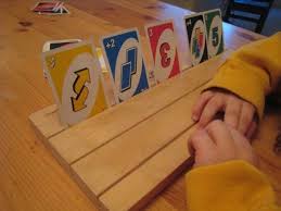 This is a playing card holder made from cardstock. Playing Card Games With Kids Card Holding Board Tutorial Playing Card Holder Playing Card Holder Kids Cards Kids Playing