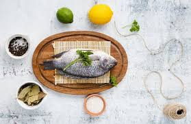 Download Top View Arrangement With Delicious Fish On Wooden Plate For Free In 2020 Wooden Plates Seafood Plates The Fish Market