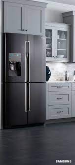 Contemporary upscale home kitchen interior with cherry wood cabinets, quartz countertops, sustainable recycled linoleum floors & stainless steel appliances including refrigerator & gas stove. The Next Thing In Kitchen Inspiration Is The Samsung Black Stainless Steel 4 Door Flex Kitchen Inspirations Kitchen Cabinets Makeover Black Appliances Kitchen