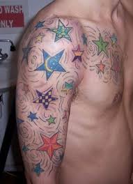Colored Stars Tattoos On The Shoulder And Chest Of Men These Are Very Unique Tattoo Designs For Mens Chest Star Tattoos For Men Star Tattoos Tattoos For Guys