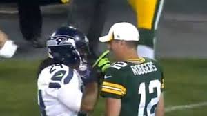 I'd love to get the chance to hang out with marshawn lynch he's a super cool guy. Marshawn Lynch Bear Hugs Aaron Rodgers Tickles His Mustache During Packers Seahawks Game Video Nesn Com