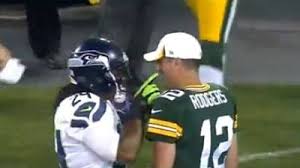 Marshawn lynch is about as far from a media darling as one can get. Marshawn Lynch Bear Hugs Aaron Rodgers Tickles His Mustache During Packers Seahawks Game Video Nesn Com