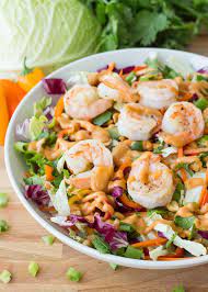 This spicy thai shrimp salad is made with plump, juicy shrimp, fresh herbs and veggies, and drizzled in a spicy yet delicious thai salad dressing. Grilled Shrimp Thai Salad With A Spicy Peanut Dressing The Table Thai Salads Thai Shrimp Salad Best Seafood Recipes