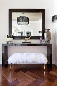 Jonathan Adler Large Mongolian Lamb Bench Tucked Under Black Waterfall Console Table Contemporary Entrance Foyer Decorating Console Table Decorating Decor