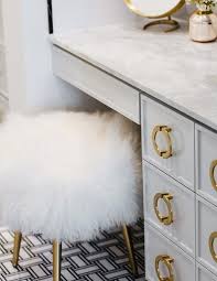 Black And Gold Makeup Room A Stunning Gray Apothecary Style Makeup Vanity Is Adorned With Antique Brass Hardware And A Gray Marble Patterned Floor Tiles Grey And Gold Bedroom Makeup Room