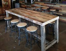 It can be as simple or elaborate as you and your budget allow: Reclaimed Wood Bar Table Restaurant Counter Community Communal Etsy Wood Bar Table Reclaimed Wood Bars Pub Table Sets
