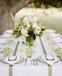 Southern Weddings Magnolia Leaf Centerpiece Once Wed Wedding Table Themes Green Wedding Inspiration Magnolia Leaves Centerpiece In diameter artificial arrangement of magnolia leaves hues of green features a stable base of woven branches.