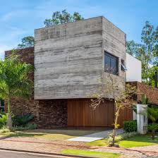 Material trio forms windowless front of UABI's Alpha House in Brazil